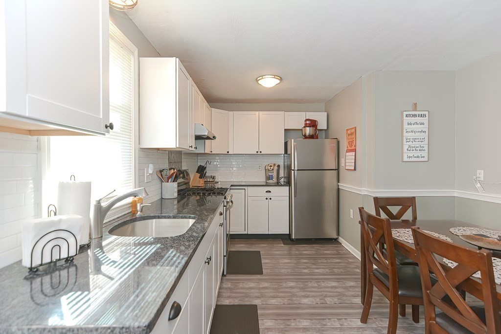 43 Cliff Road Bourne, MA 02532 - Photo 7 of 21 a kitchen with refrigerator cabinets and a sink
