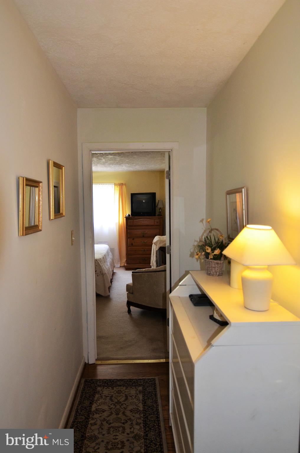 820 Petem Road Kingsville, MD 21087 - Photo 21 of 30 a bedroom with a bed and wooden floor