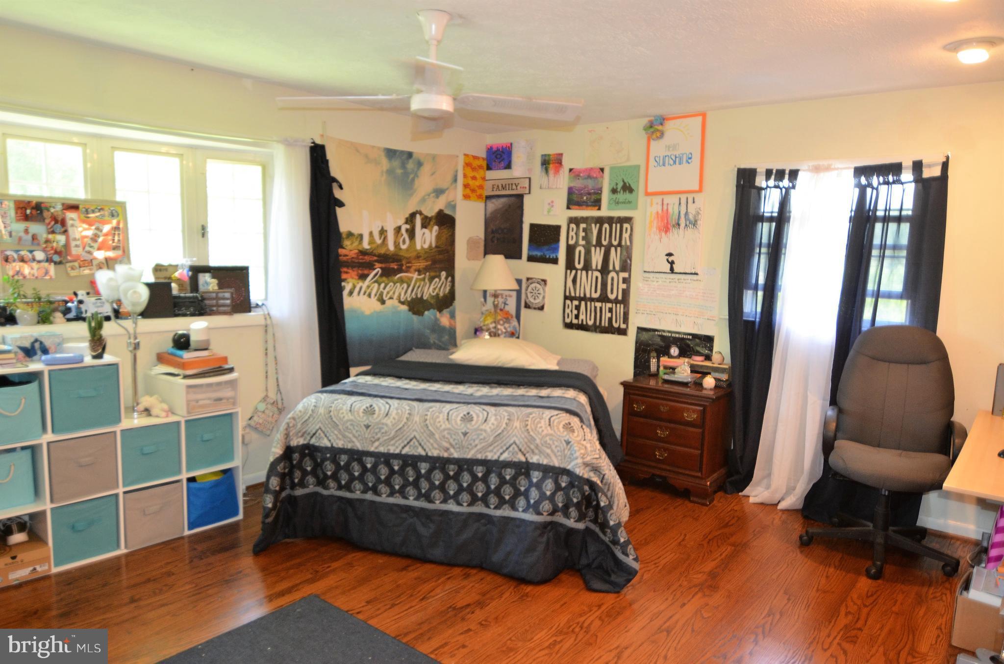 820 Petem Road Kingsville, MD 21087 - Photo 25 of 30 a bedroom with a bed bookshelf and a large window