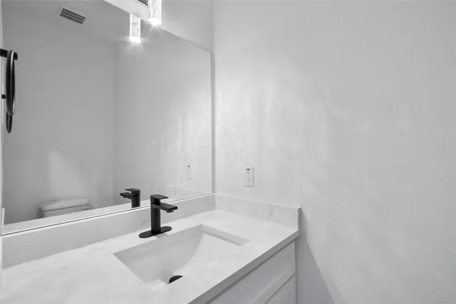 a bathroom with a sink and a vanity