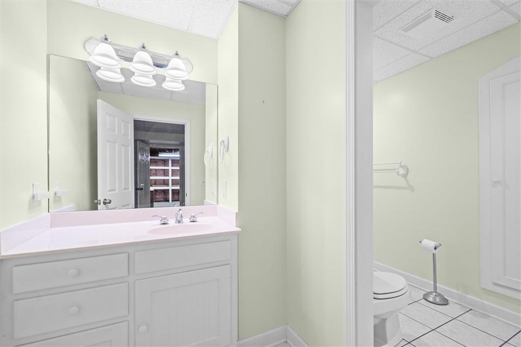 1030 Lakeview Parkway Villa Rica, GA 30180 - Photo 27 of 46 a bathroom with a sink and a mirror