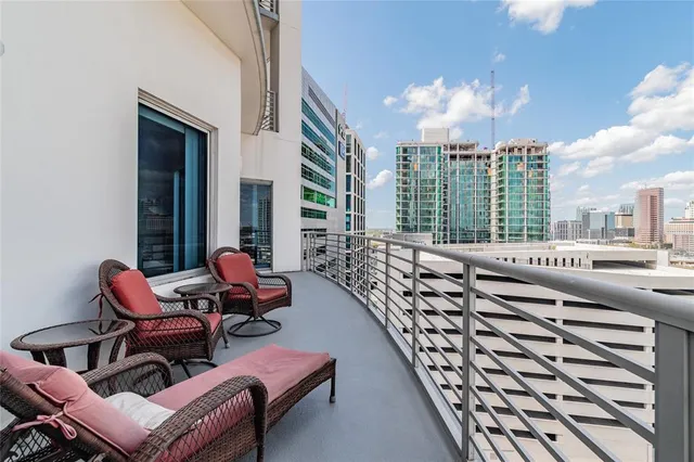 a view of a balcony with a potted plant
