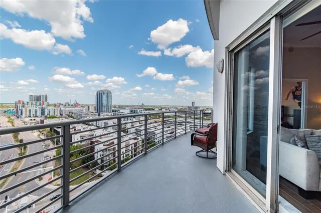 a view of a patio with a table and chairs in a patio