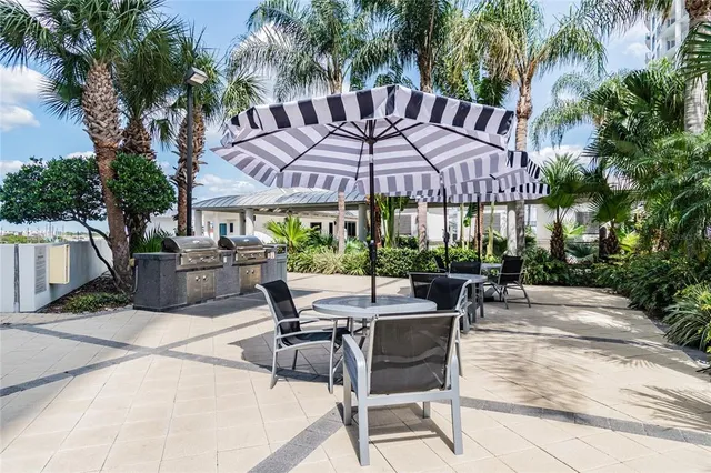 a outdoor space with lots of white furniture and mirrors