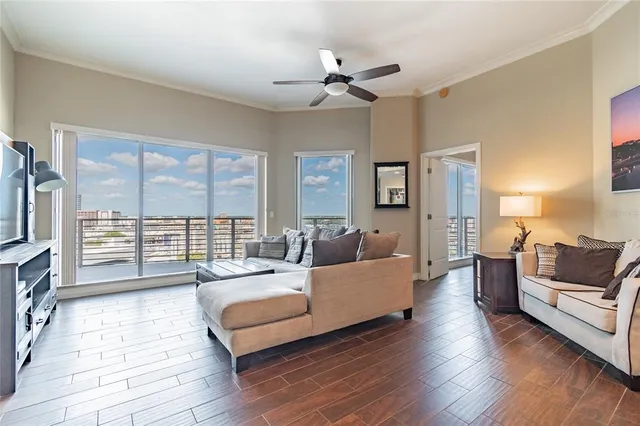 a living room with fireplace furniture and a flat screen tv