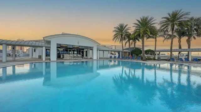 a view of residential house with outdoor space and lake view