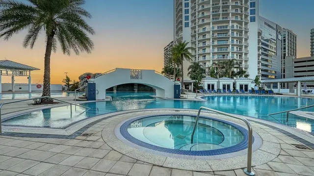 a view of swimming pool with outdoor seating