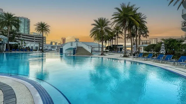 a living room with lots of furniture and a large window