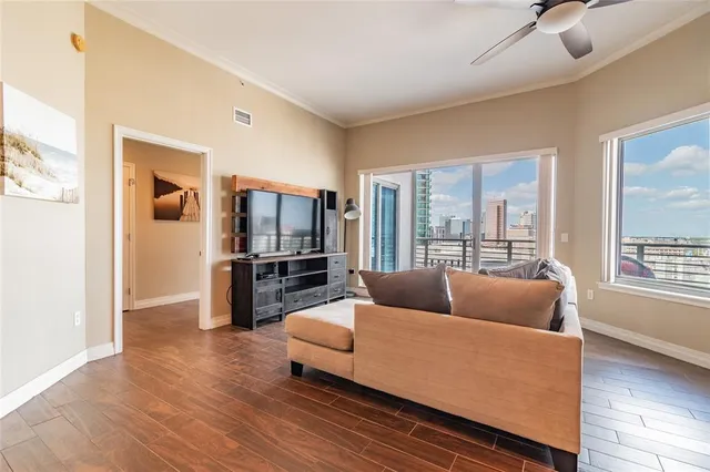 a living room with furniture and a large window