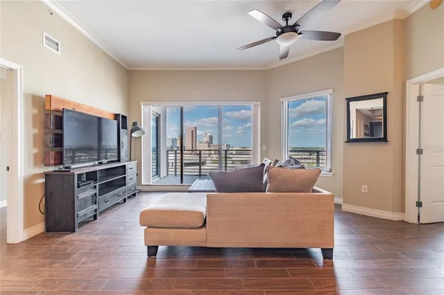 a kitchen with stainless steel appliances granite countertop a sink a stove and microwave