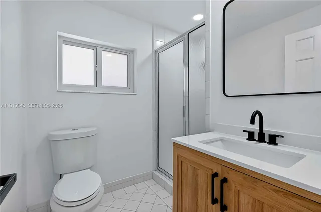 an aerial view of house with swimming pool outdoor seating and yard