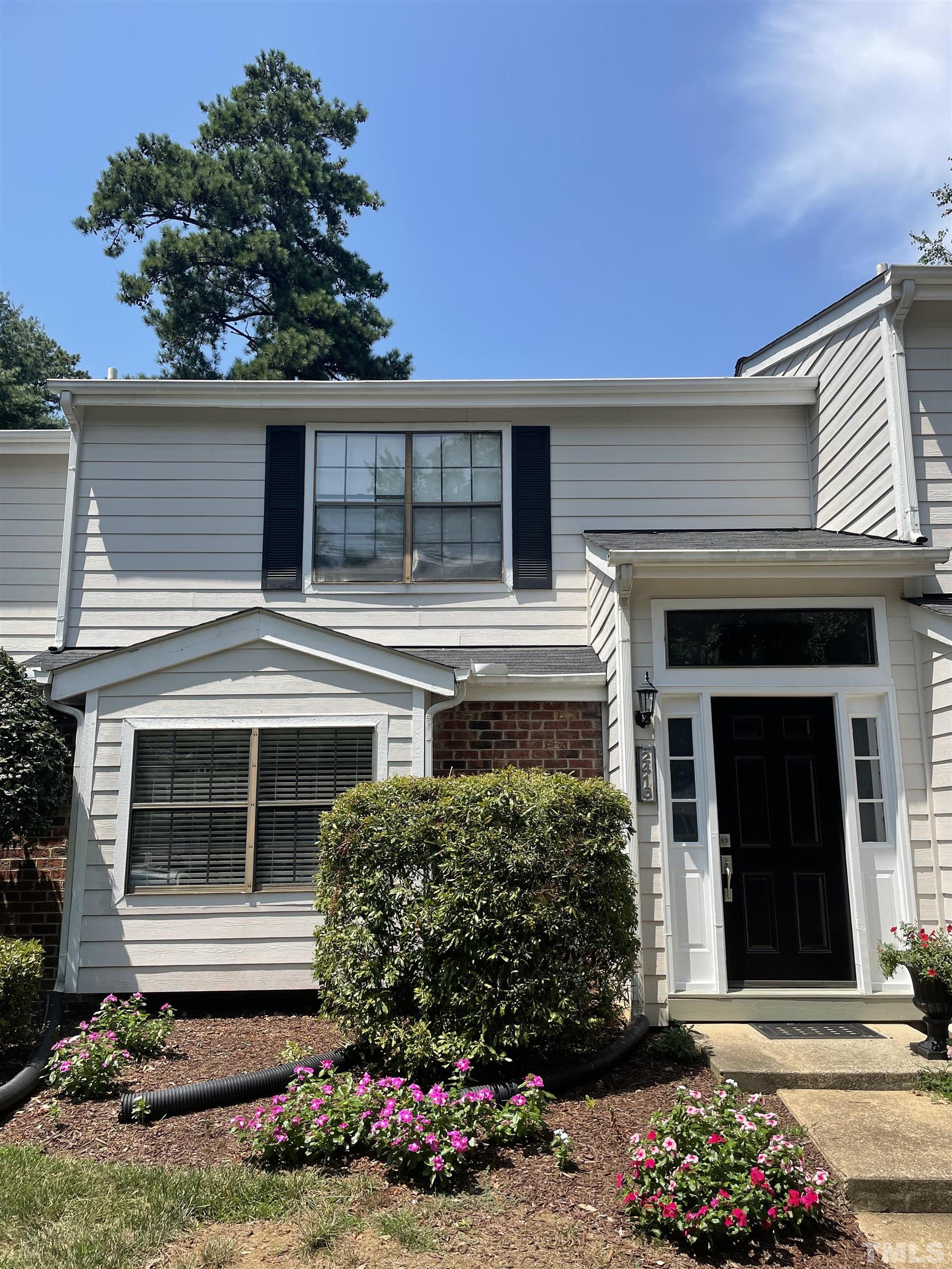 2416 Condor Court Raleigh, NC 27615 - Photo 1 of 28 front view of a house with a yard