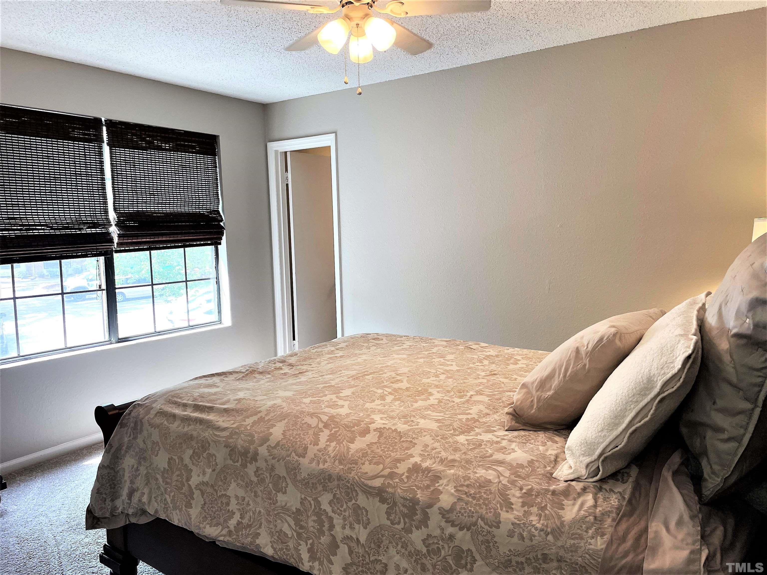 2416 Condor Court Raleigh, NC 27615 - Photo 13 of 28 a bedroom with a bed and a window