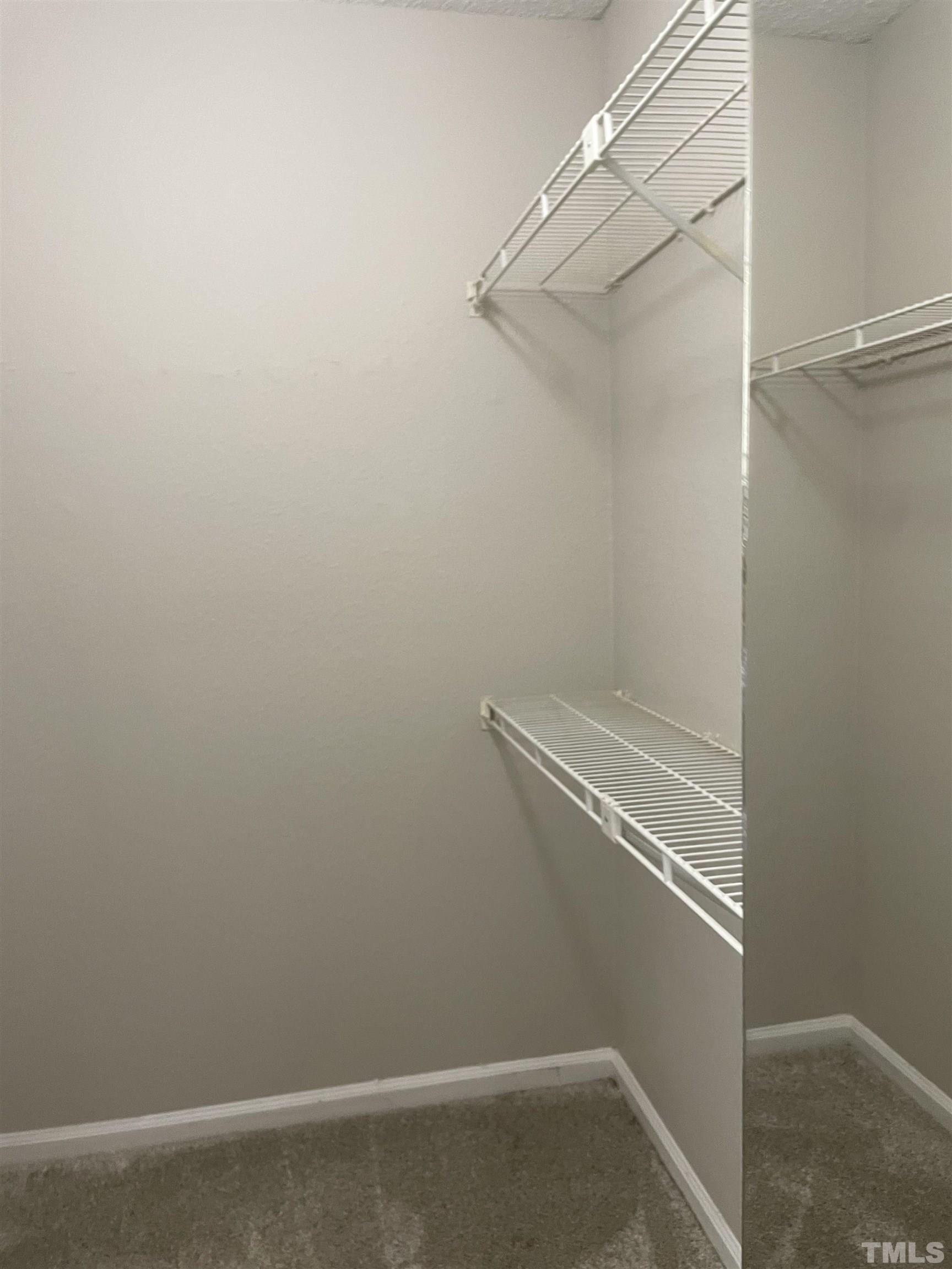 2416 Condor Court Raleigh, NC 27615 - Photo 19 of 28 a view of small space with racks on the wall