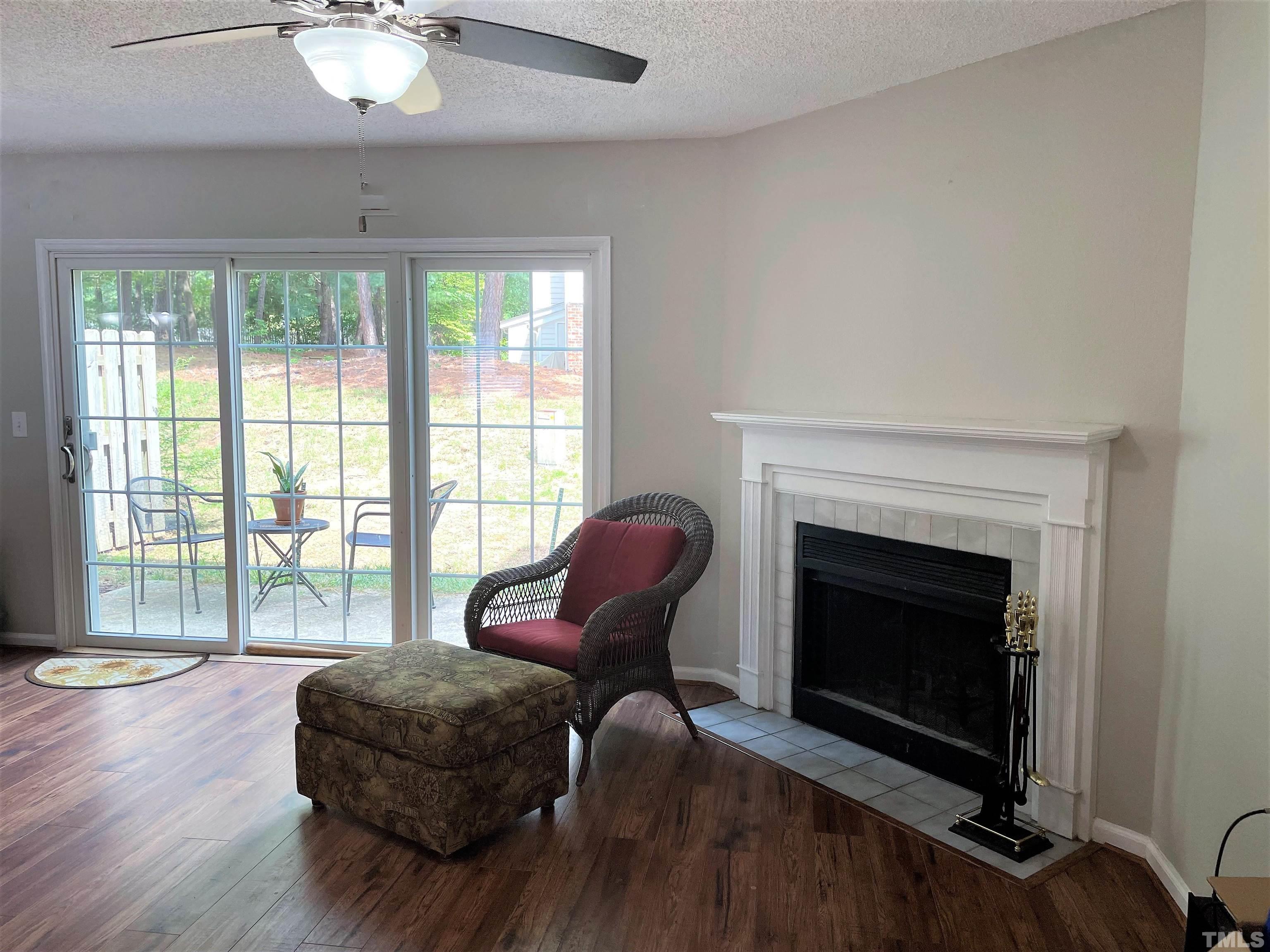 2416 Condor Court Raleigh, NC 27615 - Photo 8 of 28 a living room with furniture and a fireplace