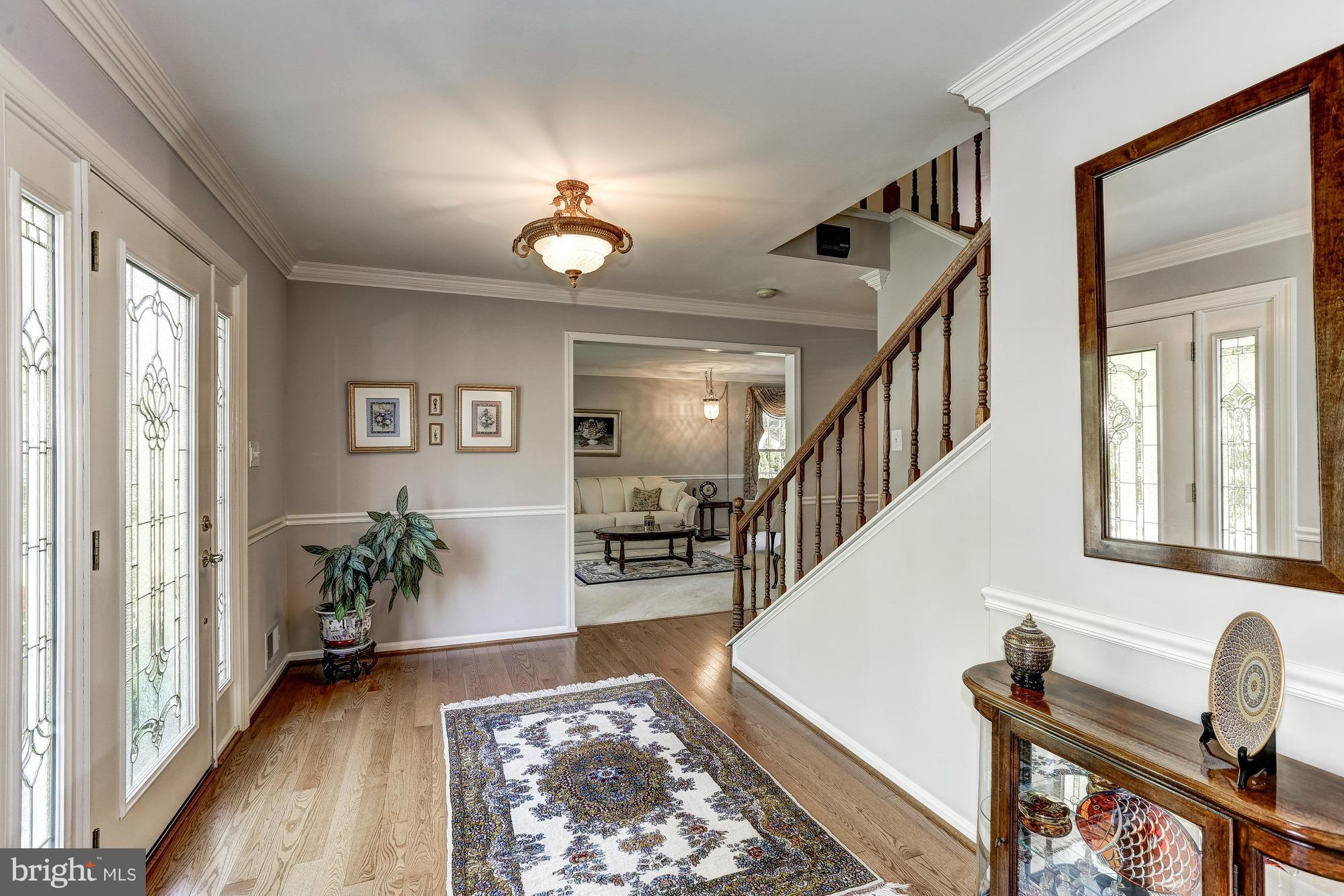 11819 Riders Lane Reston, VA 20191 - Photo 3 of 30 a view of an entryway with wooden floor and a rug