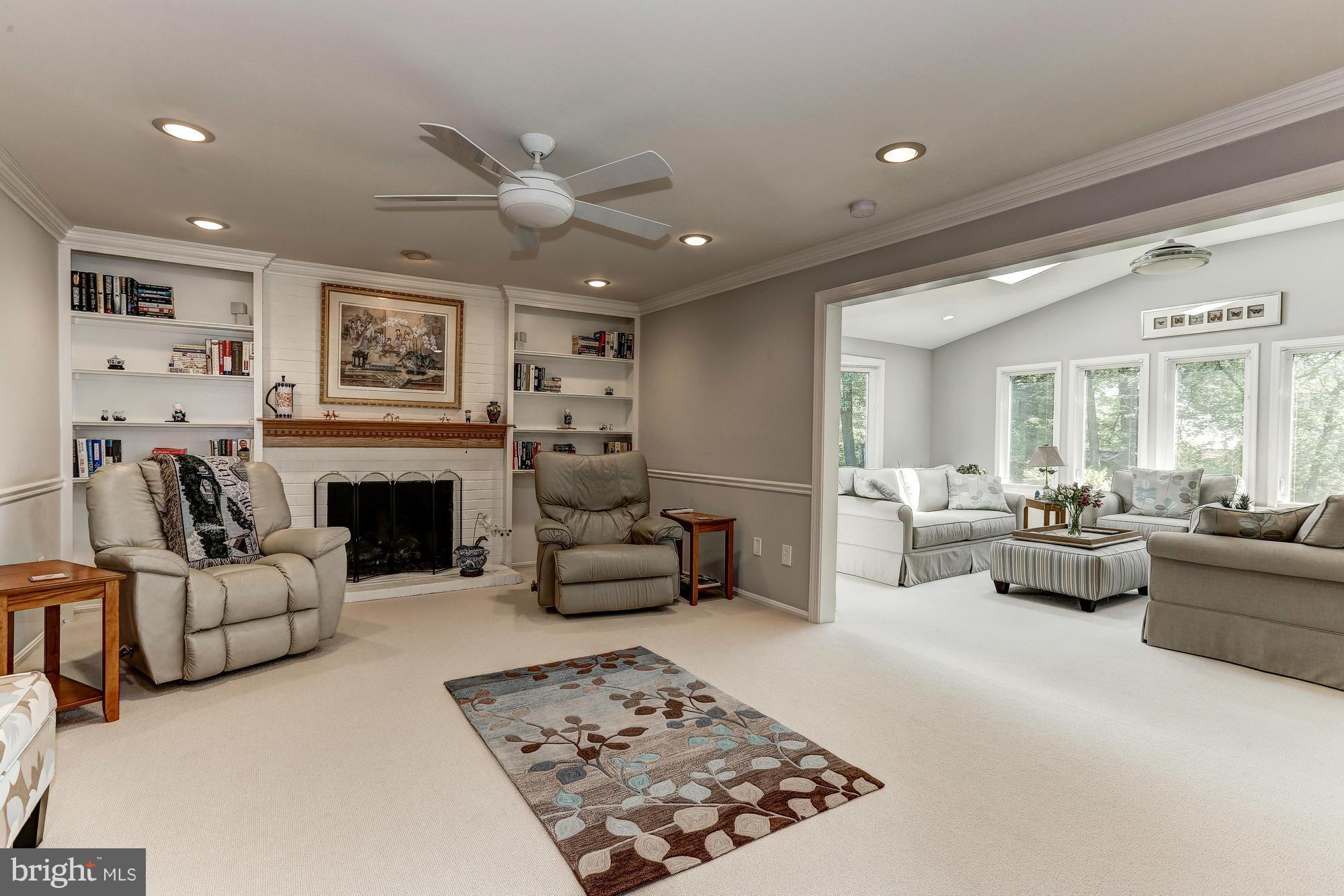 11819 Riders Lane Reston, VA 20191 - Photo 8 of 30 a living room with furniture and a fireplace