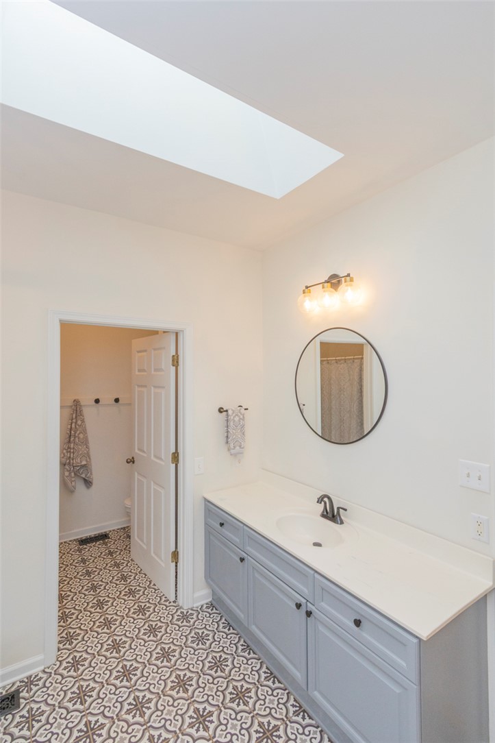 108 Pearman Drive Pendleton, SC 29670 - Photo 32 of 50 Bright and airy bath with a sleek vanity and patterned tile flooring.