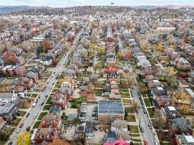 an aerial view of a house with a swimming pool