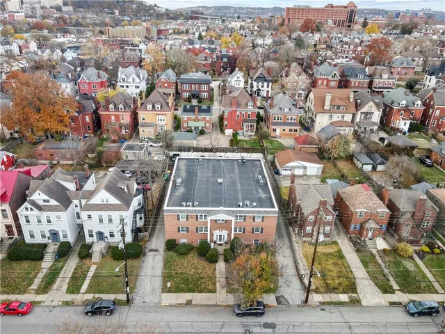 an aerial view of residential house with outdoor space