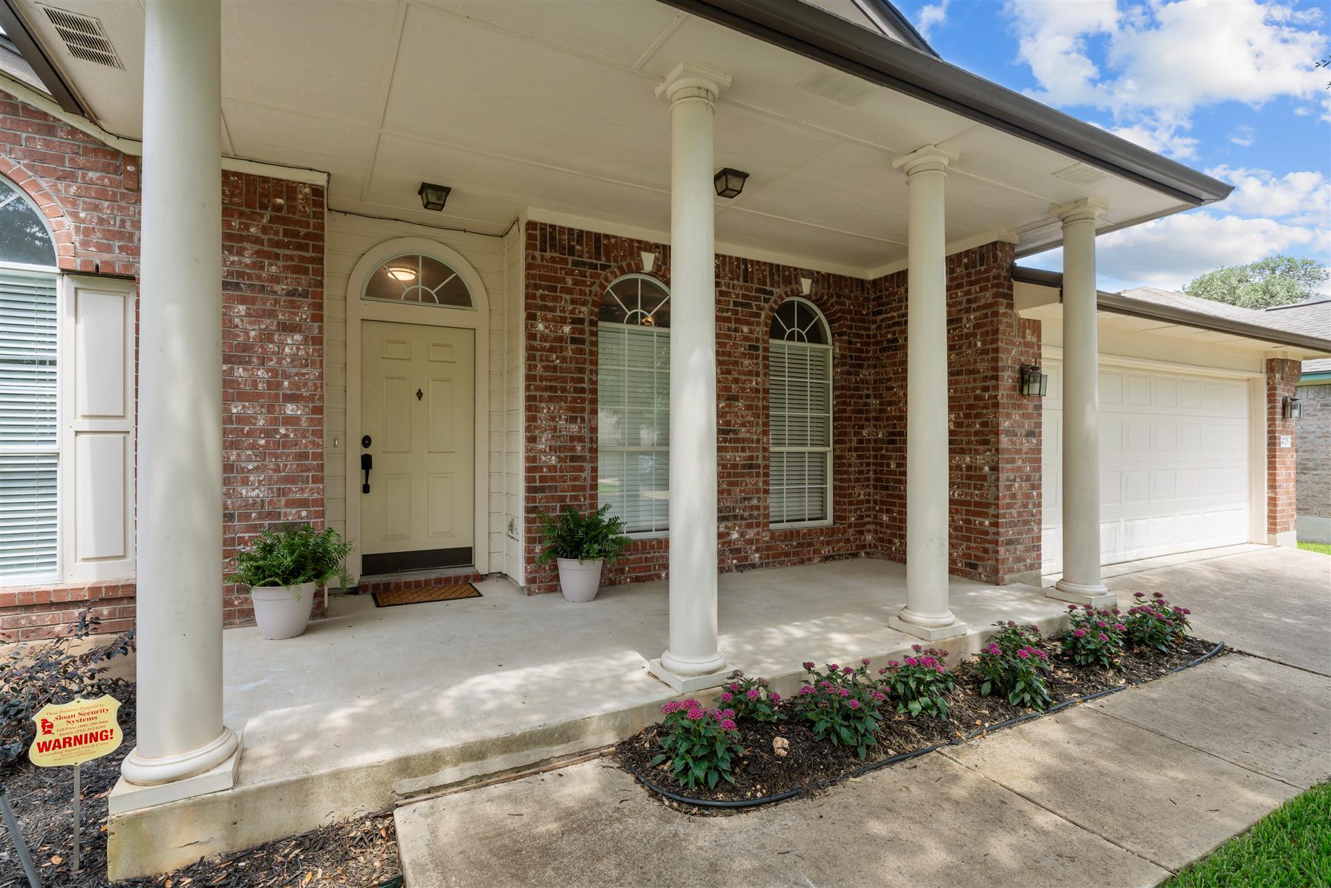 4725 Tello Path Austin, TX 78749 - Photo 34 of 34 A welcoming brick facade with a columned front porch provides inviting curb appeal.