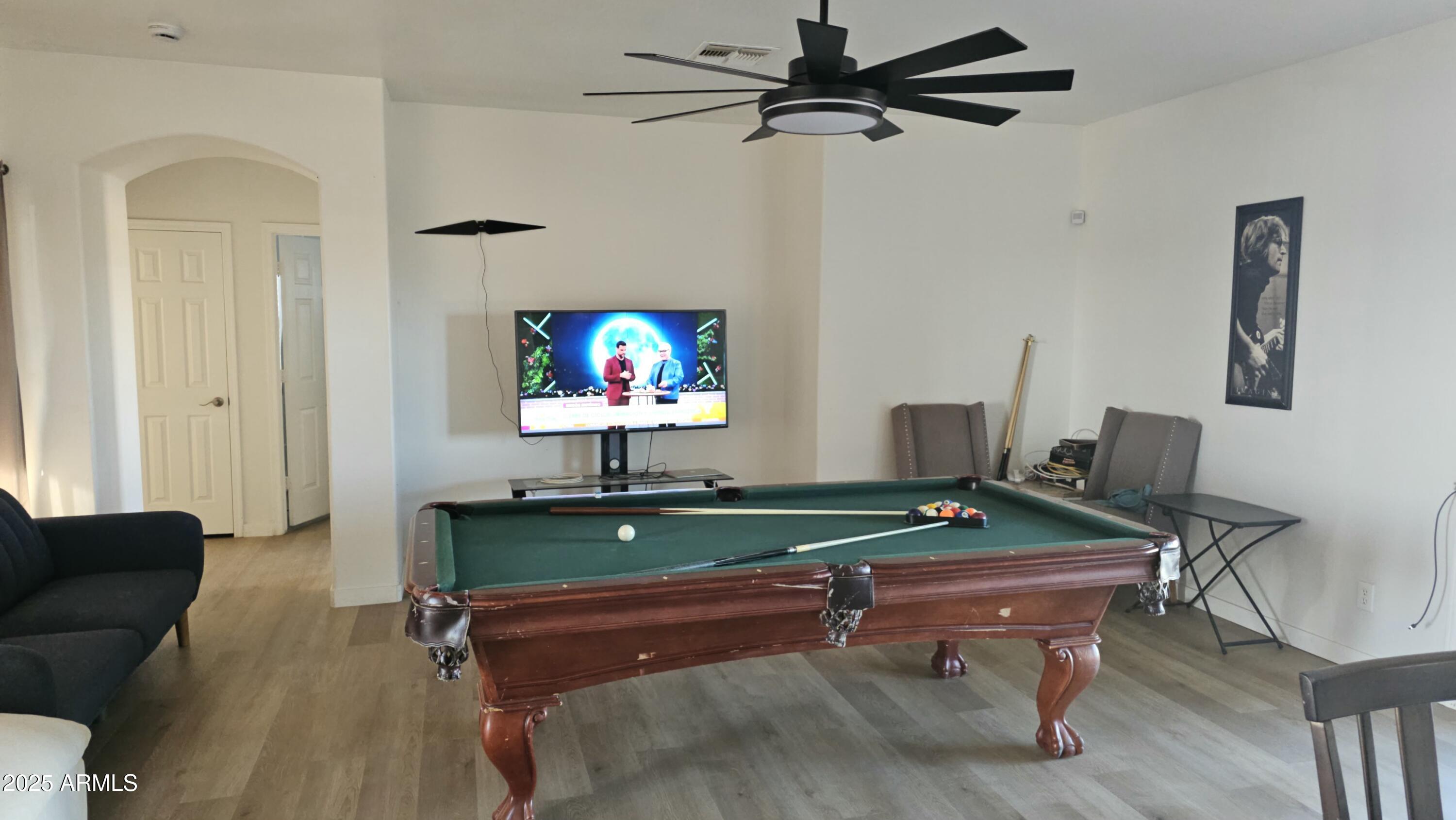 33340 West Lower Buckeye Road Tonopah, AZ 85354 - Photo 11 of 28 a room with furniture and a flat screen tv