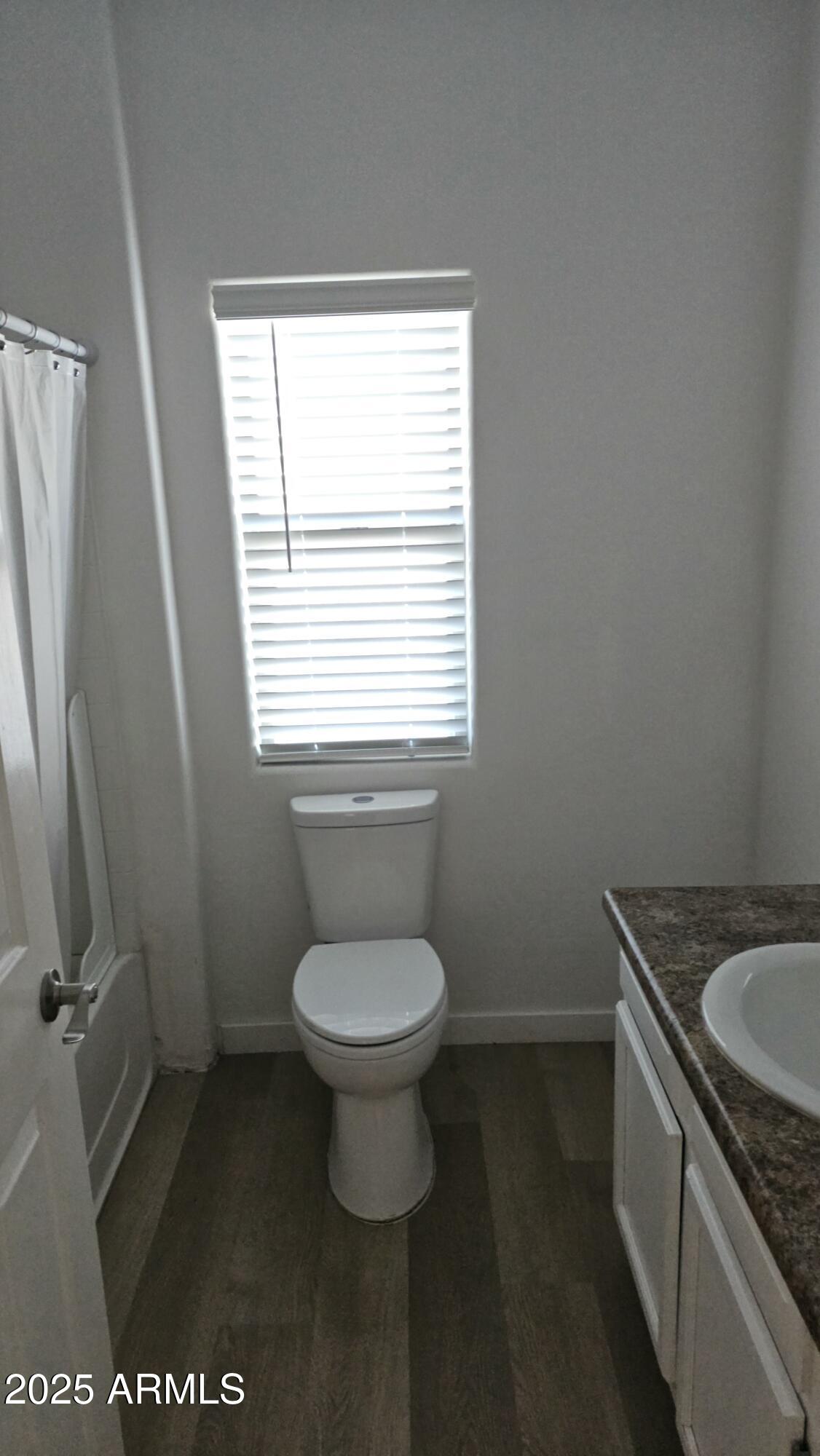 33340 West Lower Buckeye Road Tonopah, AZ 85354 - Photo 15 of 28 a bathroom with a granite countertop toilet and a sink
