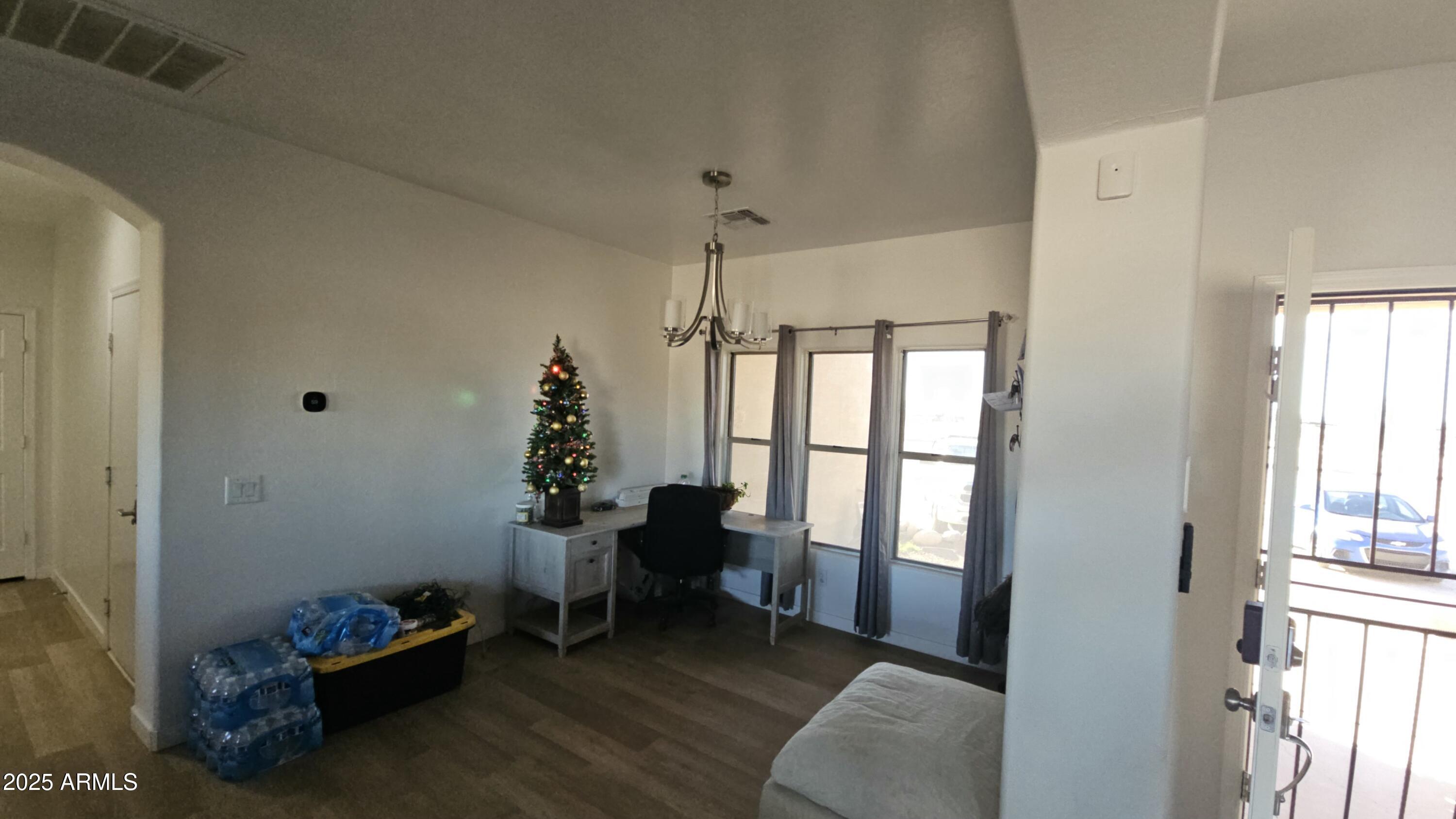 33340 West Lower Buckeye Road Tonopah, AZ 85354 - Photo 18 of 28 a living room with furniture and a window