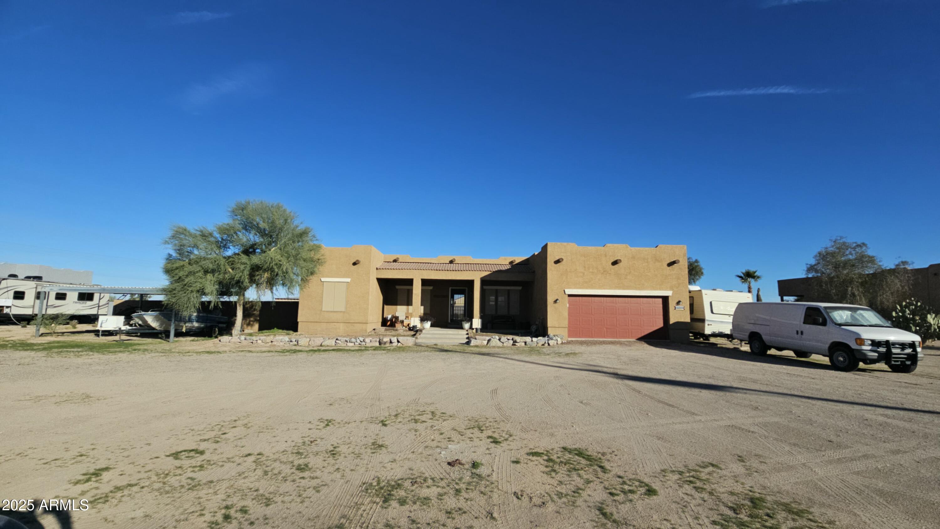 33340 West Lower Buckeye Road Tonopah, AZ 85354 - Photo 2 of 28 a car parked in front of a house