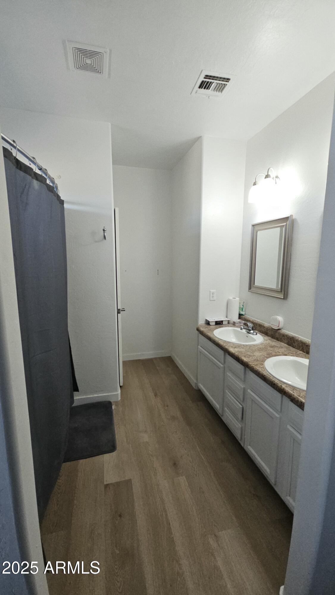 33340 West Lower Buckeye Road Tonopah, AZ 85354 - Photo 25 of 28 a bathroom with a sink a mirror and a shower