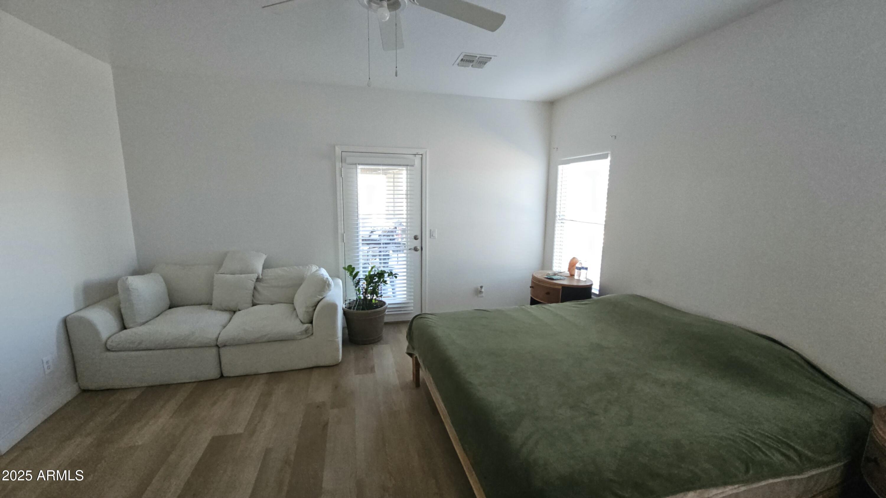 33340 West Lower Buckeye Road Tonopah, AZ 85354 - Photo 26 of 28 a living room with furniture and a window