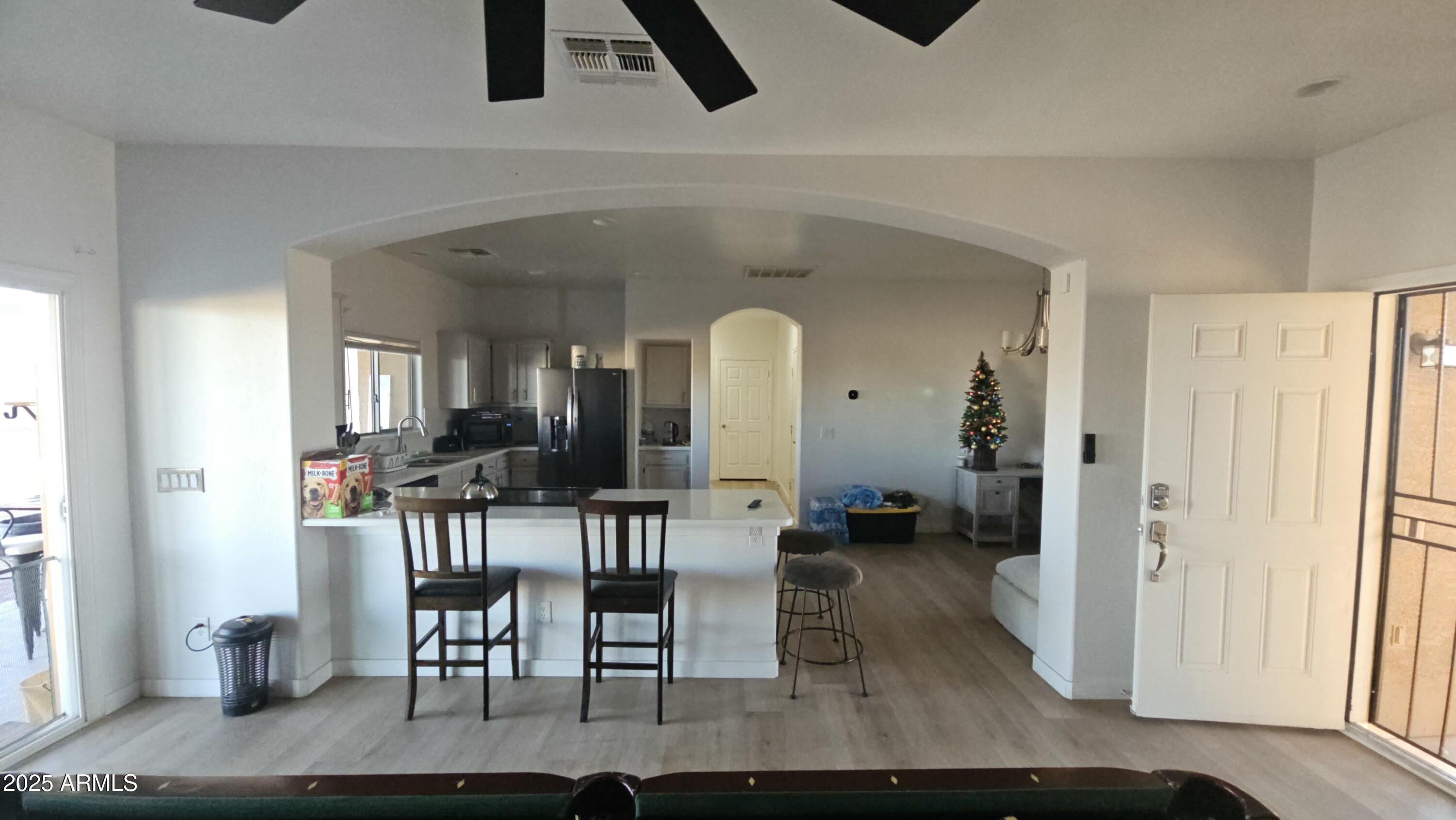 33340 West Lower Buckeye Road Tonopah, AZ 85354 - Photo 10 of 28 a view of a livingroom with furniture and windows