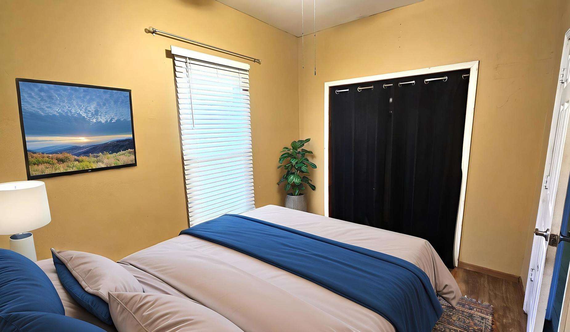 426 North Hebbard Street Joliet, IL 60432 - Photo 33 of 42 a bedroom with a bed and a painting on the wall