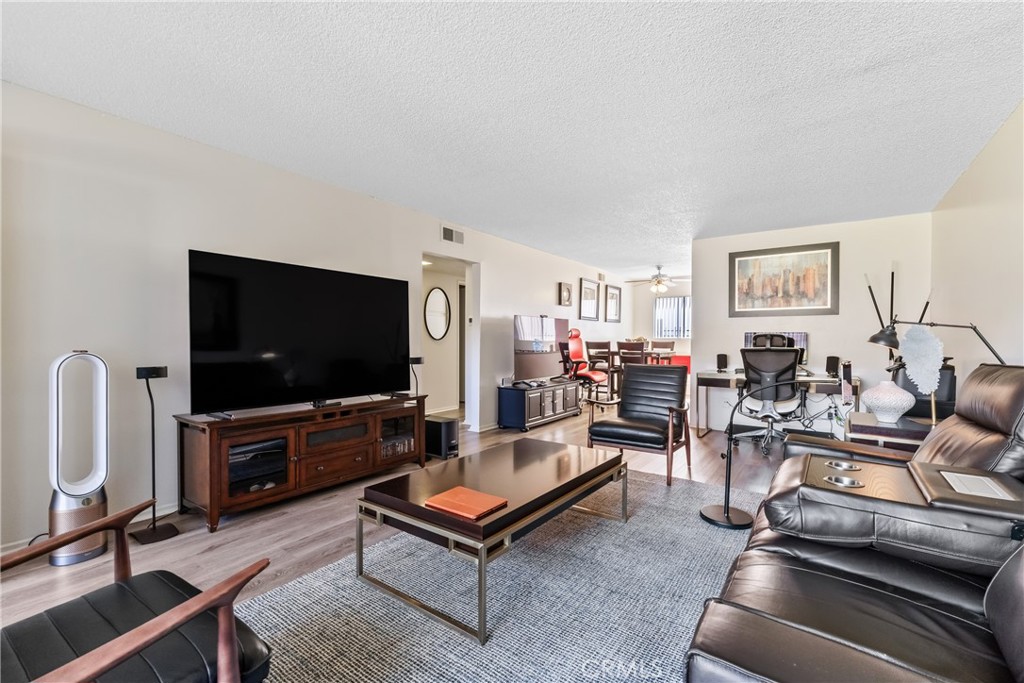 4641 Arlington Avenue Riverside, CA 92504 - Photo 14 of 33 a living room with furniture and a flat screen tv