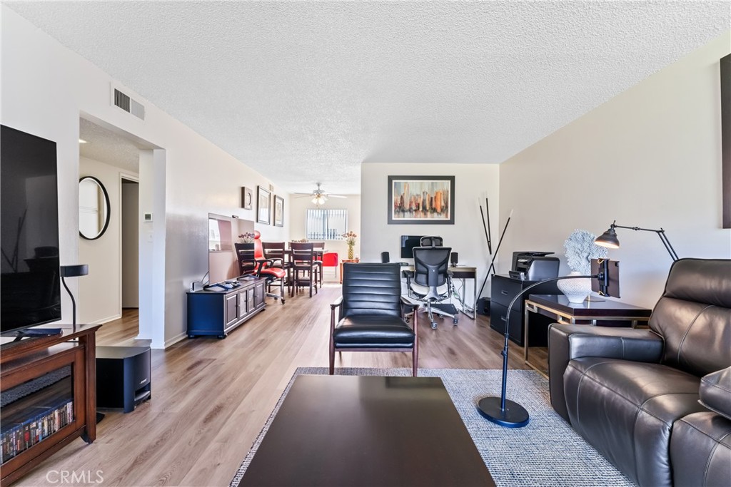 4641 Arlington Avenue Riverside, CA 92504 - Photo 19 of 33 a living room with furniture and a flat screen tv