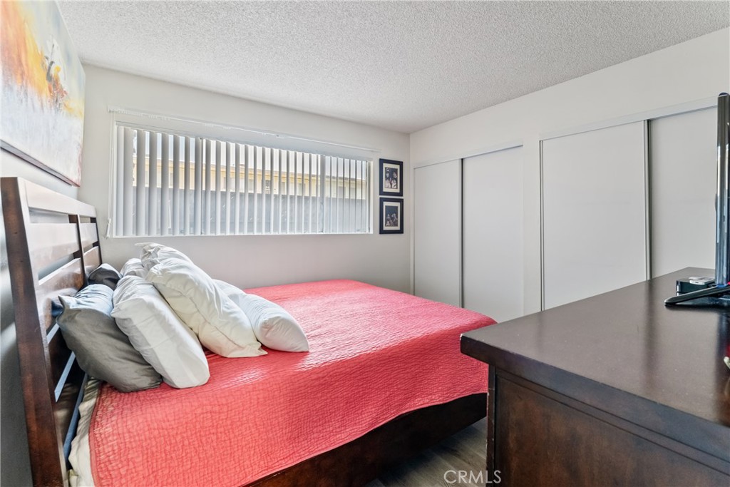 4641 Arlington Avenue Riverside, CA 92504 - Photo 20 of 33 a bedroom with a bed and a dresser