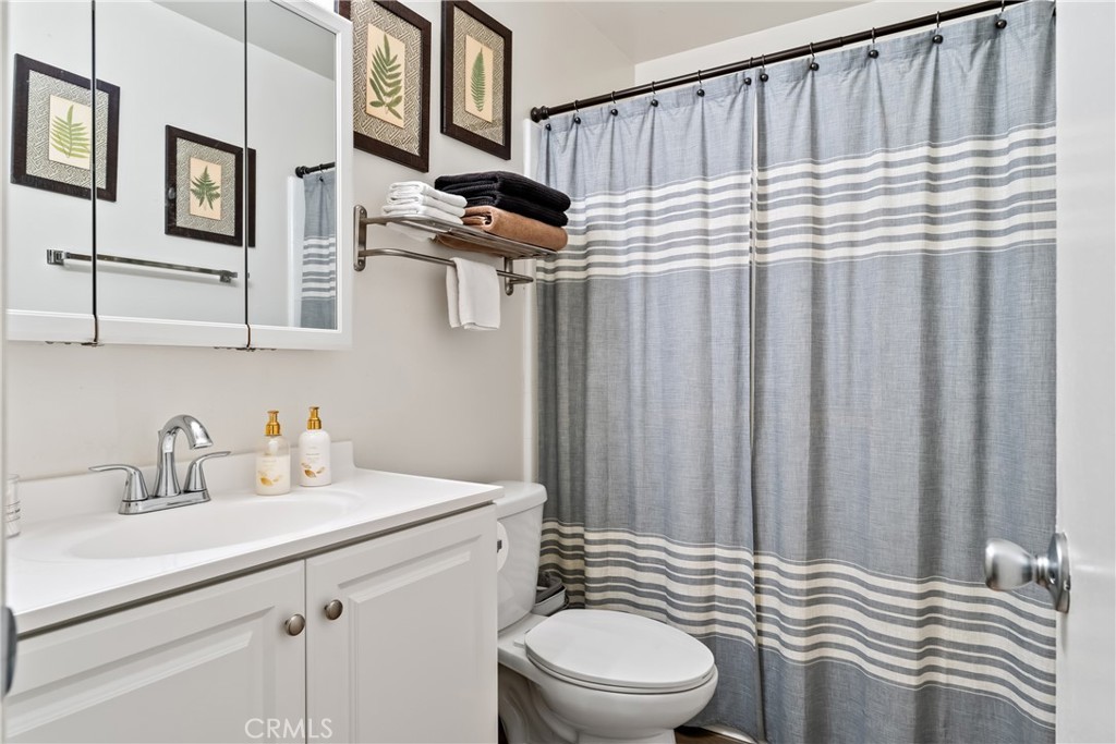 4641 Arlington Avenue Riverside, CA 92504 - Photo 25 of 33 a bathroom with a sink a toilet and shower
