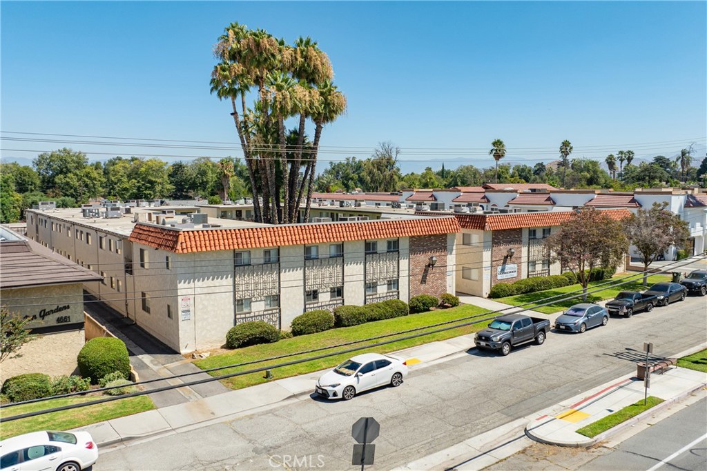 4641 Arlington Avenue Riverside, CA 92504 - Photo 33 of 33 a view of a swimming pool with lawn chairs and a yard