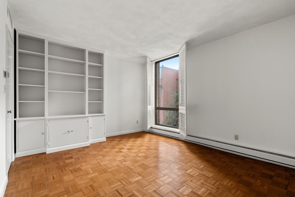 75 Grove Street, Unit 227 Wellesley, MA 02482 - Photo 23 of 29 a view of an empty room with a window