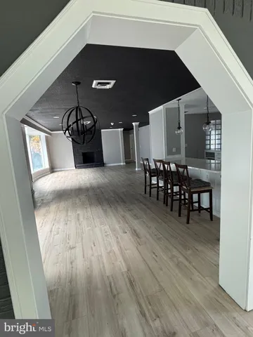 a view of a livingroom with furniture and chandelier