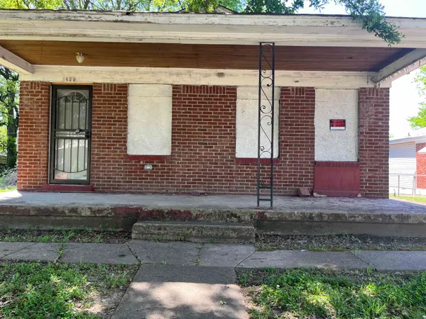 a front view of a house with garage