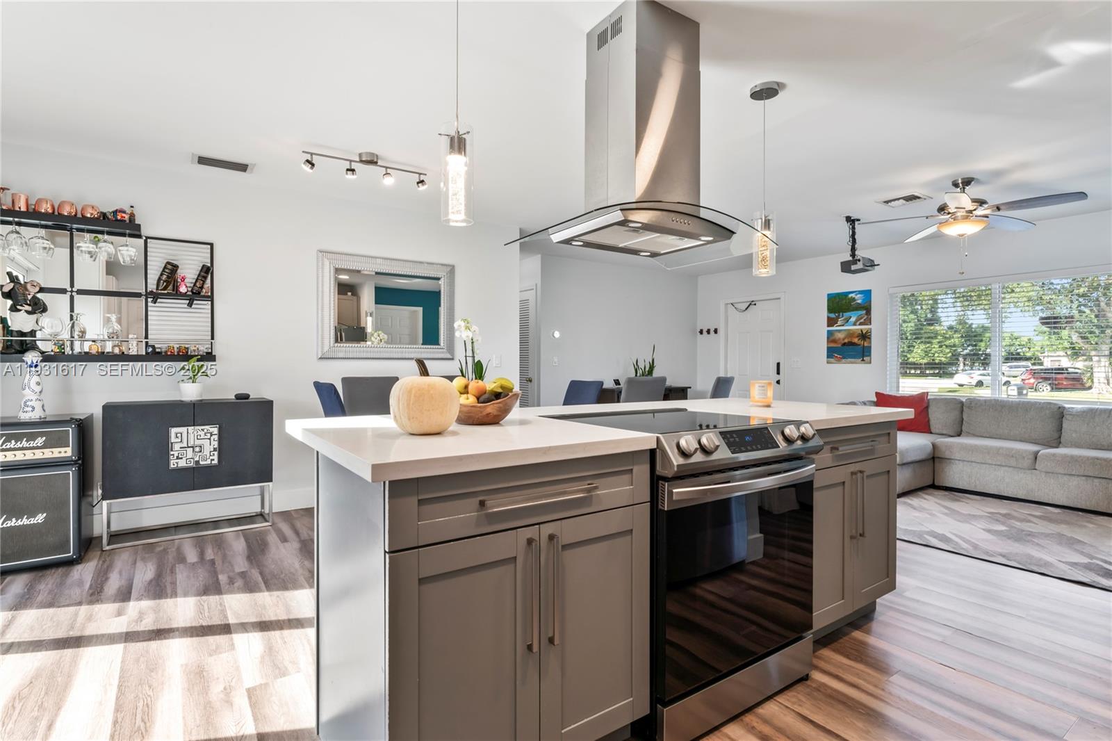 9612 Wyoming Court Boca Raton, FL 33434 - Photo 12 of 44 a kitchen with stainless steel appliances granite countertop a stove and a fireplace