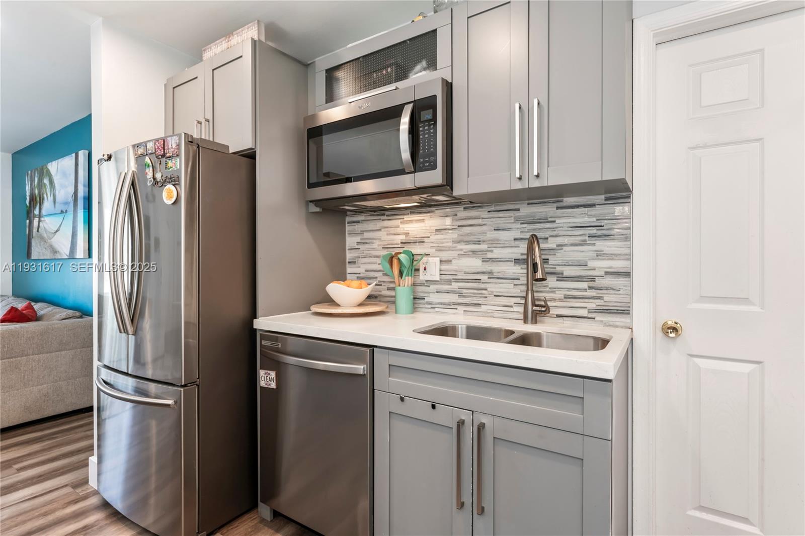 9612 Wyoming Court Boca Raton, FL 33434 - Photo 13 of 44 a kitchen with stainless steel appliances a refrigerator and a stove top oven