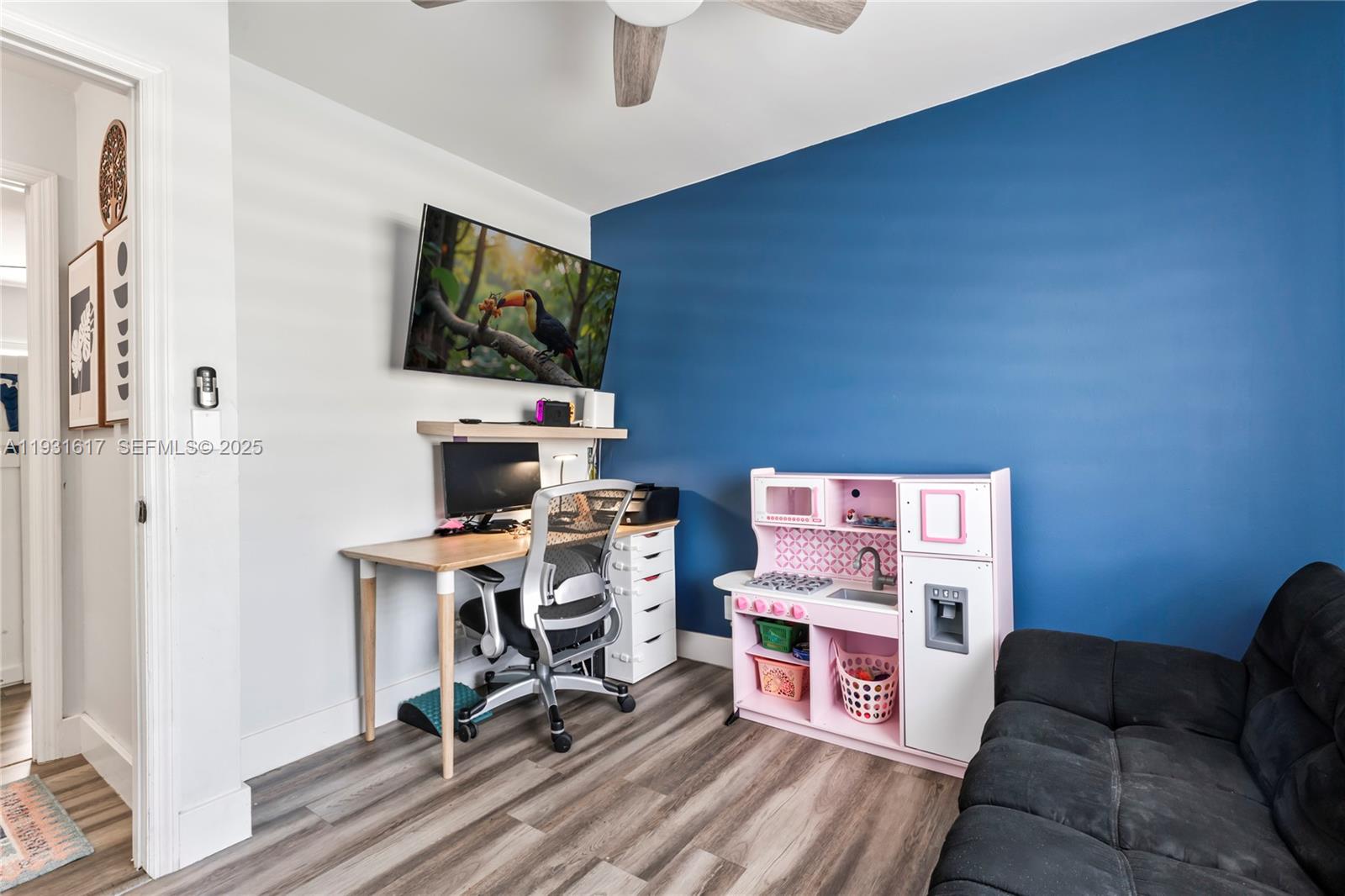 9612 Wyoming Court Boca Raton, FL 33434 - Photo 16 of 44 a workspace with furniture and a flat screen tv