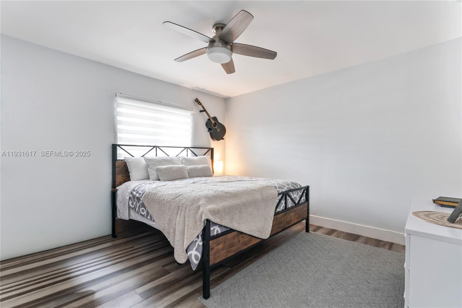 9612 Wyoming Court Boca Raton, FL 33434 - Photo 19 of 44 a bedroom with a bed and a ceiling fan