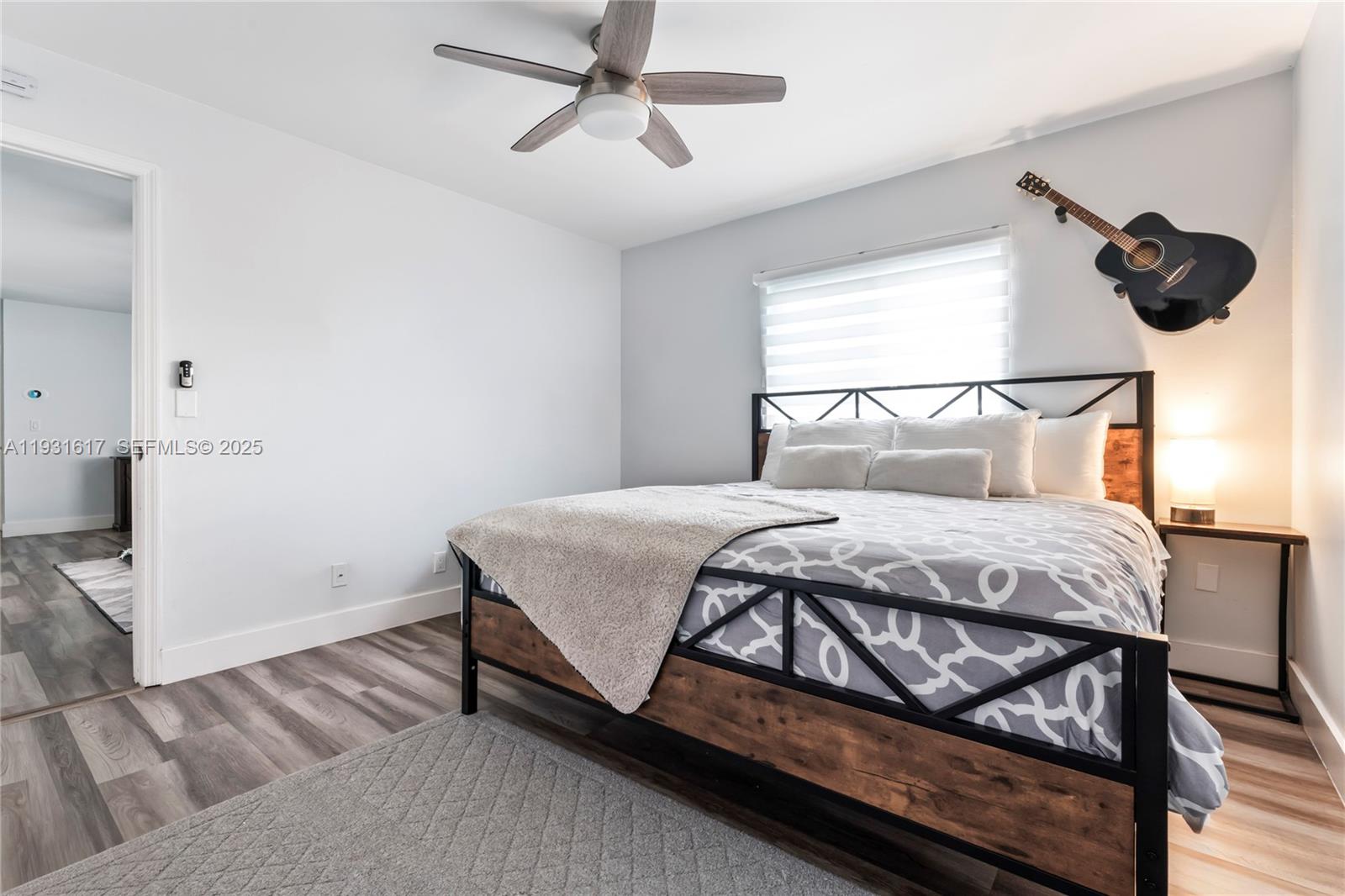 9612 Wyoming Court Boca Raton, FL 33434 - Photo 20 of 44 a bedroom with a bed and cabinets