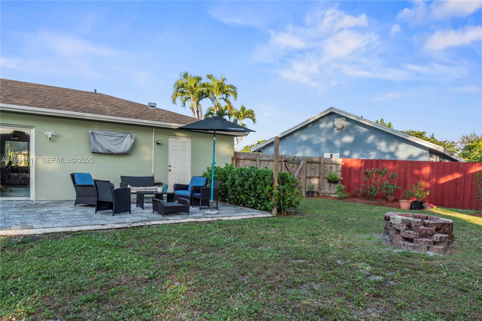 9612 Wyoming Court Boca Raton, FL 33434 - Photo 29 of 44 a view of a house with a yard porch and sitting area