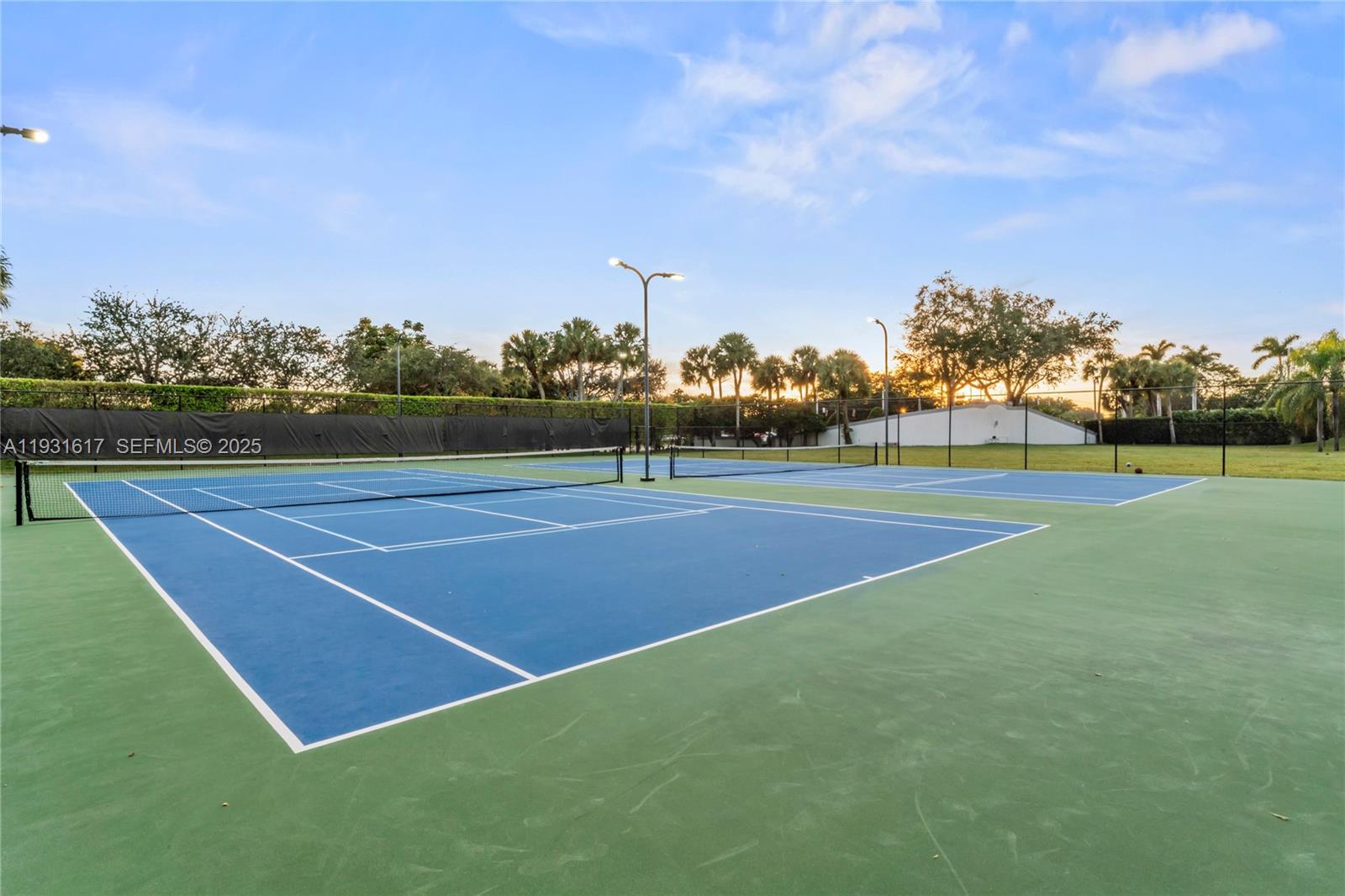 9612 Wyoming Court Boca Raton, FL 33434 - Photo 36 of 44 a view of an outdoor space and tennis court