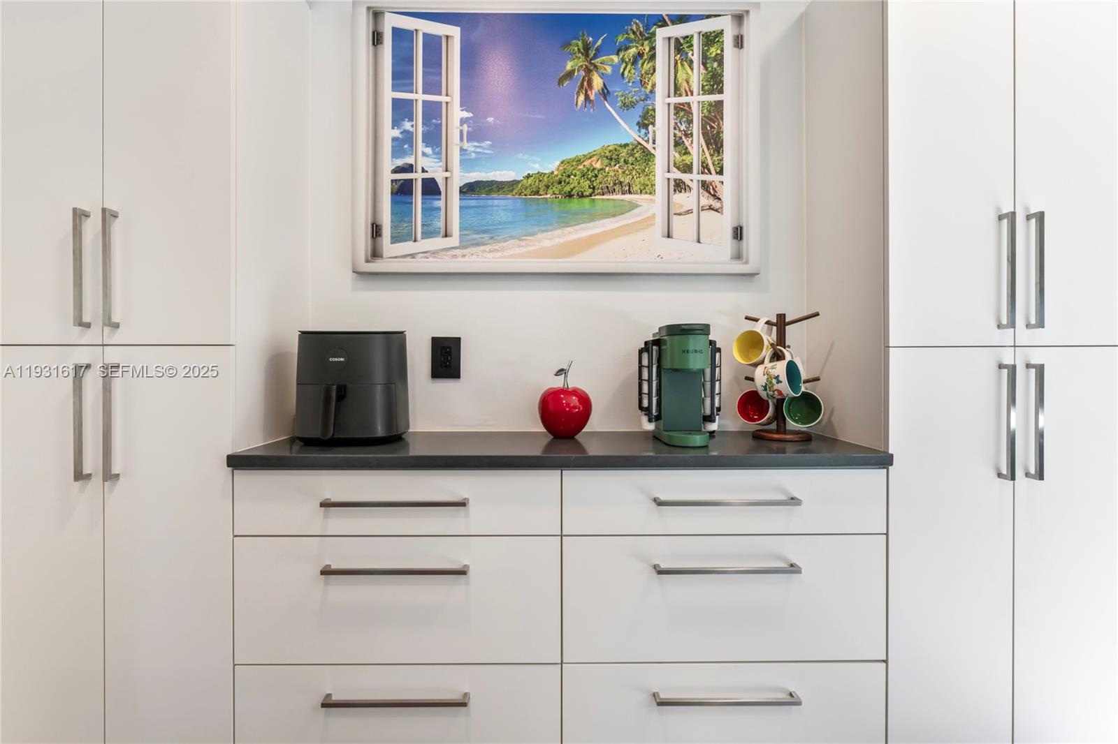 9612 Wyoming Court Boca Raton, FL 33434 - Photo 8 of 44 a kitchen with white cabinets and white appliances