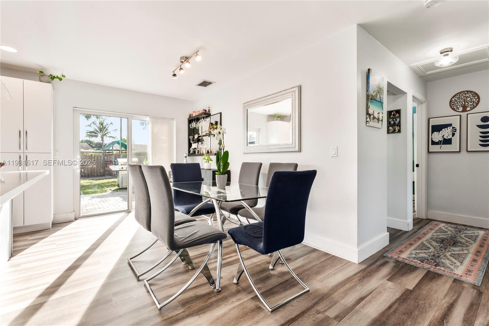 9612 Wyoming Court Boca Raton, FL 33434 - Photo 9 of 44 a workspace with wooden floor and furniture